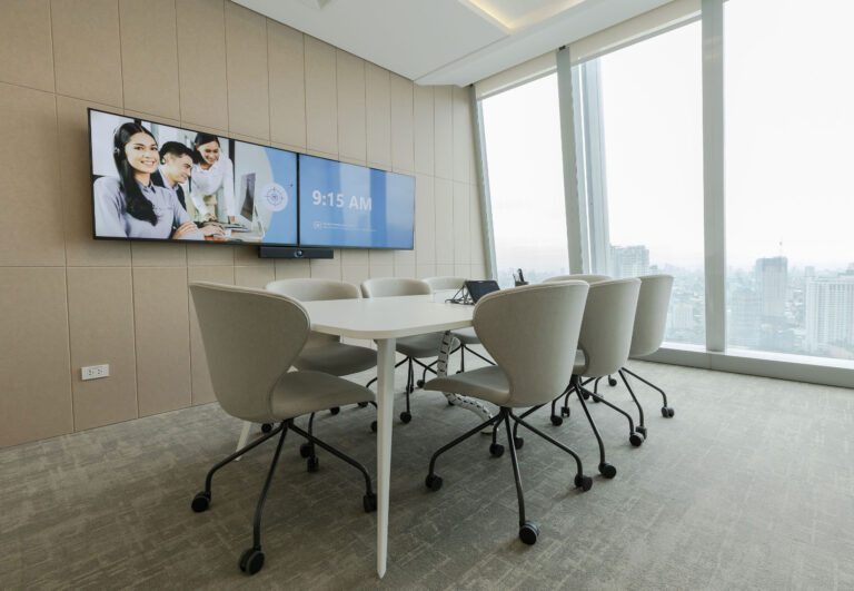 An image of a conference room with a view of the city of Manila.
